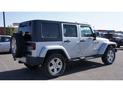 jeep wrangler unlimited 2010 silver suv sahara gasoline 6 cylinders 4 wheel drive 6 speed manual 79065