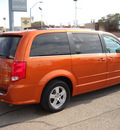 dodge grand caravan 2011 orange van flex fuel 6 cylinders front wheel drive automatic 79925
