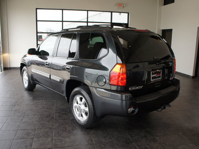 gmc envoy 2003 black suv slt gasoline 6 cylinders 4 wheel drive automatic 76087