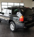 gmc envoy 2003 black suv slt gasoline 6 cylinders 4 wheel drive automatic 76087