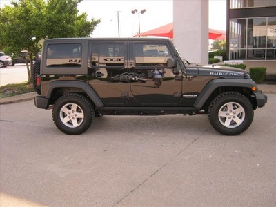 jeep wrangler unlimited 2011 black suv rubicon gasoline 6 cylinders 4 wheel drive 75080