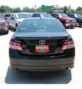 toyota camry 2011 black sedan se gasoline 4 cylinders front wheel drive automatic with overdrive 77706