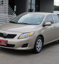 toyota corolla 2009 tan sedan le gasoline 4 cylinders front wheel drive automatic with overdrive 77074