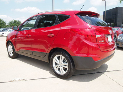 hyundai tucson 2011 dk  red gls gasoline 4 cylinders front wheel drive automatic 75150