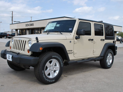 jeep wrangler unlimited 2011 brown suv sport gasoline 6 cylinders 4 wheel drive automatic 76011