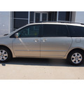 toyota sienna 2009 tan van xle gasoline 6 cylinders front wheel drive automatic with overdrive 77802