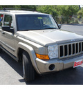 jeep commander 2006 tan suv gasoline 6 cylinders 4 wheel drive automatic 78501