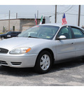 ford taurus 2005 silver sedan sel gasoline 6 cylinders front wheel drive automatic with overdrive 77023