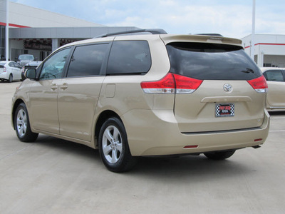 toyota sienna 2011 tan van le 8 passenger gasoline 6 cylinders front wheel drive automatic with overdrive 77469