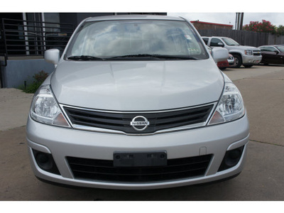 nissan versa 2011 silver hatchback gasoline 4 cylinders front wheel drive automatic 77034