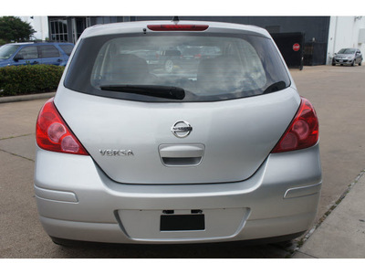 nissan versa 2011 silver hatchback gasoline 4 cylinders front wheel drive automatic 77034
