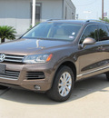 volkswagen touareg 2011 brown suv vr6 sport gasoline 6 cylinders all whee drive shiftable automatic 77074