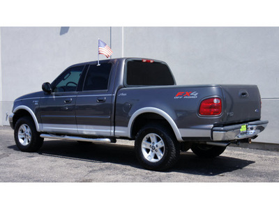 ford f 150 2003 dk  gray lariat gasoline 8 cylinders sohc 4 wheel drive automatic 79407