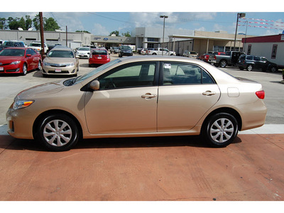 toyota corolla 2011 tan sedan le gasoline 4 cylinders front wheel drive automatic with overdrive 77706