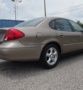 ford taurus 2002 gold sedan se gasoline 6 cylinders front wheel drive 4 speed automatic 77532