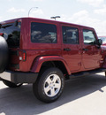 jeep wrangler unlimited 2011 red suv sahara gasoline 6 cylinders 4 wheel drive automatic with overdrive 76011