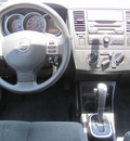 nissan versa 2011 black hatchback gasoline 4 cylinders front wheel drive automatic 33884