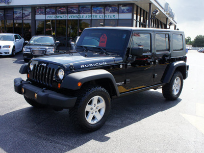 jeep wrangler unlimited 2010 black suv rubicon gasoline 6 cylinders 4 wheel drive automatic 33021