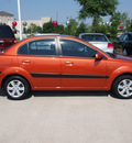 kia rio 2009 orange sedan lx gasoline 4 cylinders front wheel drive automatic 77090
