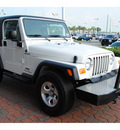 jeep wrangler 2004 white suv sport gasoline 6 cylinders 4 wheel drive 5 speed manual 77450