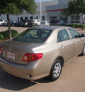 toyota corolla 2010 tan sedan le gasoline 4 cylinders front wheel drive automatic 76053