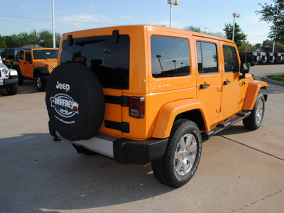 jeep wrangler unlimited 2012 orange suv sahara gasoline 6 cylinders 4 wheel drive not specified 75093