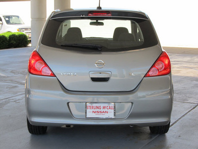 nissan versa 2010 silver hatchback 1 8 sl gasoline 4 cylinders front wheel drive automatic with overdrive 77477