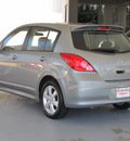 nissan versa 2010 silver hatchback 1 8 sl gasoline 4 cylinders front wheel drive automatic with overdrive 77477