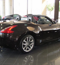 nissan 370z 2012 dk  red roadster gasoline 6 cylinders rear wheel drive shiftable automatic 77477