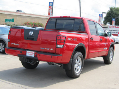 nissan titan 2012 red pro 4x flex fuel 8 cylinders 4 wheel drive automatic with overdrive 77477