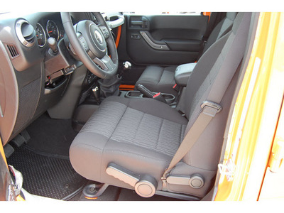 jeep wrangler unlimited 2012 orange suv sport gasoline 6 cylinders 4 wheel drive 6 speed manual 77642