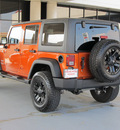 jeep wrangler unlimited 2011 orange suv sport gasoline 6 cylinders 4 wheel drive automatic with overdrive 77477