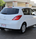 nissan versa 2010 white hatchback 1 8 s gasoline 4 cylinders front wheel drive automatic with overdrive 77477