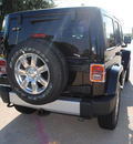 jeep wrangler unlimited 2012 black suv sahara gasoline 6 cylinders 4 wheel drive 6 speed manual 75093