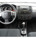 nissan versa 2011 white hatchback 1 8 sl gasoline 4 cylinders front wheel drive automatic 77034