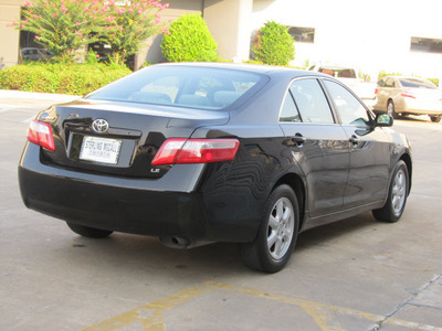 toyota camry 2009 black sedan le gasoline 4 cylinders front wheel drive automatic with overdrive 77074