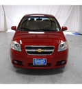 chevrolet aveo 2011 red sedan lt gasoline 4 cylinders front wheel drive automatic with overdrive 77630