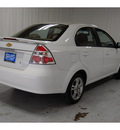 chevrolet aveo 2011 white sedan lt gasoline 4 cylinders front wheel drive automatic with overdrive 77630