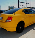 scion tc 2012 yellow coupe relese series gasoline 4 cylinders front wheel drive 6 speed manual 76011