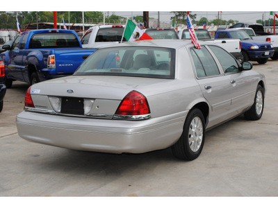 ford crown victoria 2004 silver sedan lx gasoline 8 cylinders rear wheel drive automatic with overdrive 77018