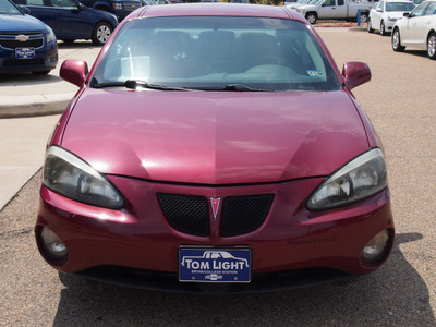 pontiac grand prix 2004 red sedan gt1 gasoline 6 cylinders front wheel drive 4 speed automatic 77802