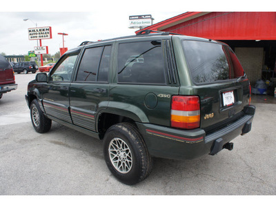 jeep grand cherokee 1995 green suv orvis gasoline 8 cylinders 4 wheel drive automatic 76543