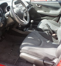 honda fit 2010 red hatchback sport gasoline 4 cylinders front wheel drive 5 speed manual 75007