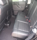 jeep wrangler unlimited 2012 black suv sahara gasoline 6 cylinders 4 wheel drive 6 speed manual 76051