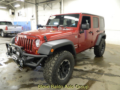 jeep wrangler 2012 red suv unlimited sport gasoline 6 cylinders 4 wheel drive automatic 14304