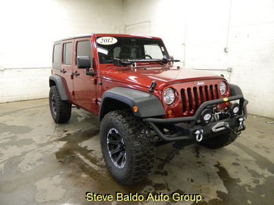 jeep wrangler 2012 red suv unlimited sport gasoline 6 cylinders 4 wheel drive automatic 14304