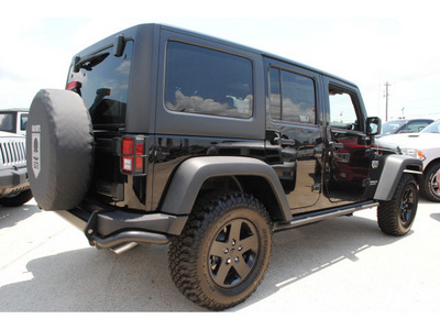 jeep wrangler unlimited 2012 black suv rubicon gasoline 6 cylinders 4 wheel drive automatic 77521