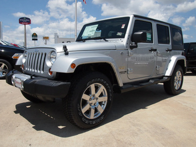 jeep wrangler unlimited 2012 bright silver suv sahara gasoline 6 cylinders 4 wheel drive automatic 77521