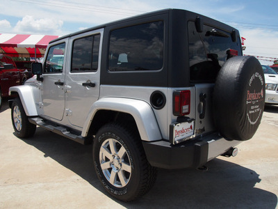 jeep wrangler unlimited 2012 bright silver suv sahara gasoline 6 cylinders 4 wheel drive automatic 77521
