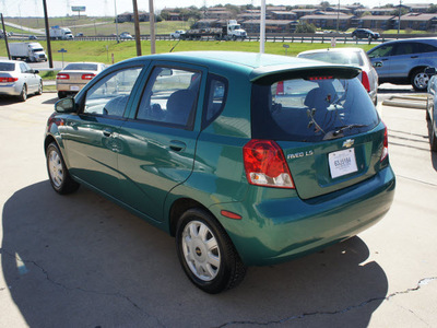 chevrolet aveo 2004 green hatchback ls gasoline 4 cylinders front wheel drive automatic with overdrive 76108